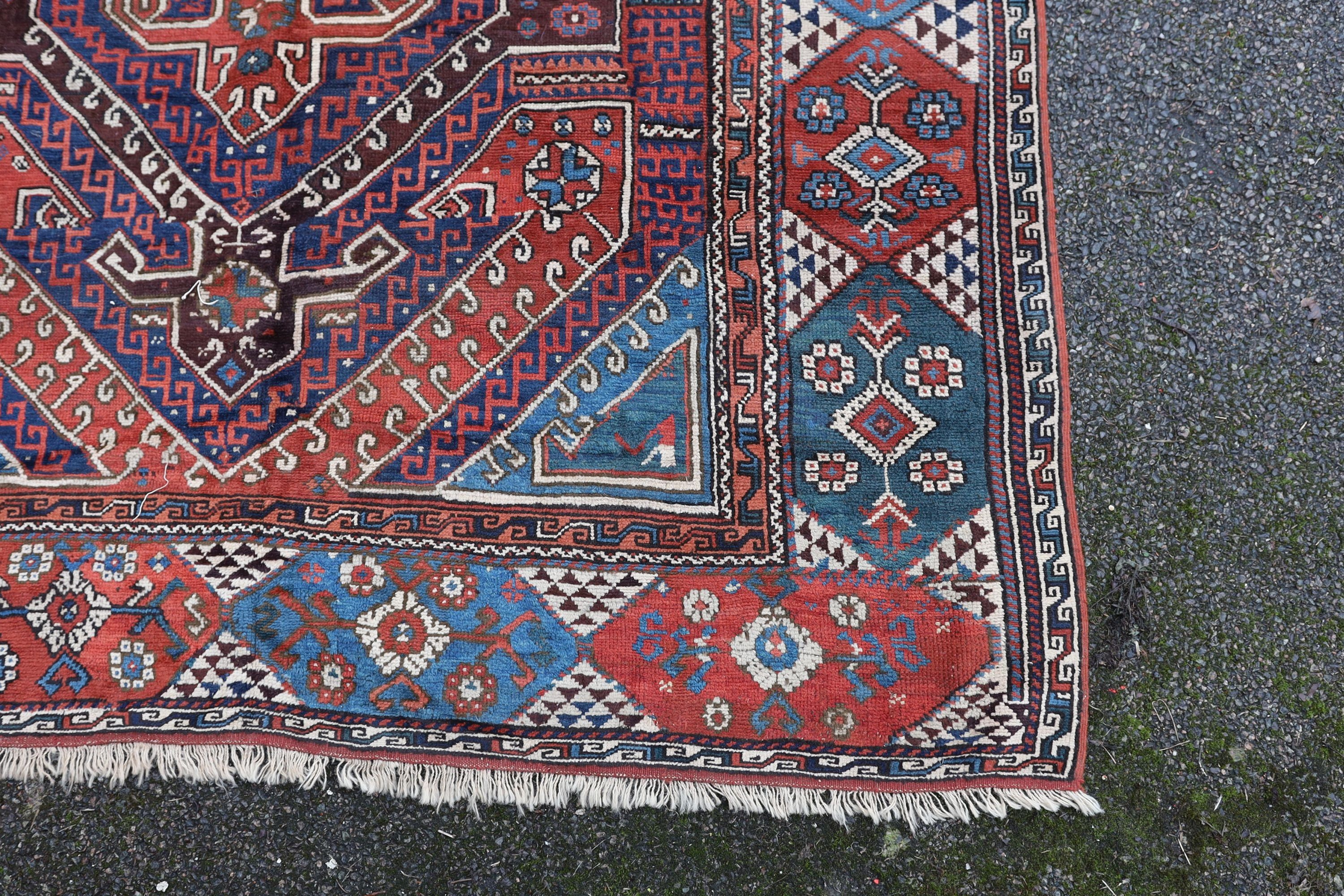 A Bergam Turkish blue ground rug 254 x 198cm